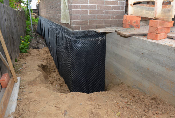 Happy homeowners after waterproofing job in Duck River
